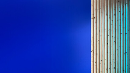 Blue Background with Vertical Wooden Strips and Stylish Design Elements