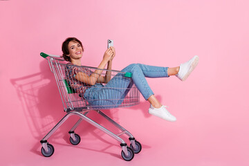 Photo of charming cheerful positive lovely girl wear stylish clothes sitting pushcart chatting...