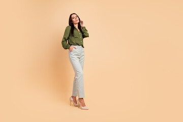 Fototapeta premium Elegant woman in classic outfit posing confidently in an indoor setting, demonstrating professional style and sophistication