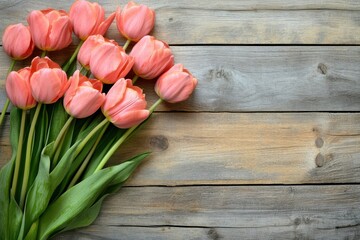 A beautiful bouquet of fresh pink tulips displayed on a rustic wooden background. This image captures the essence of spring and elegance, perfect for decor.