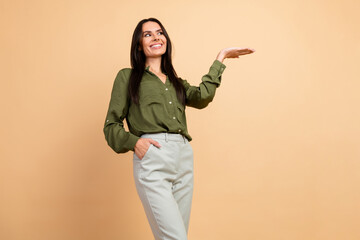 Confident businesswoman gesturing in professional attire on a beige background illustrating...