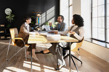 Business team discussing during meeting in modern office