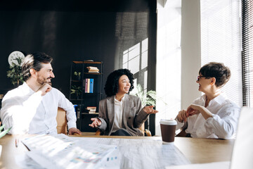 Business team discussing project during meeting in office