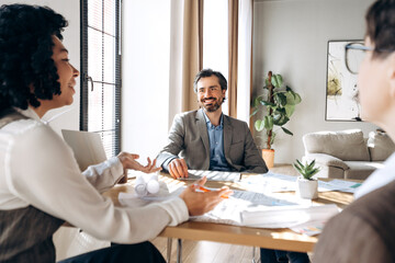 Business team discussing project during meeting in modern office