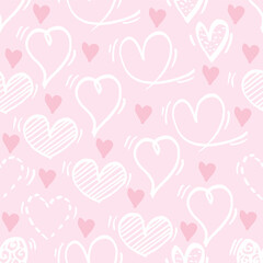 Seamless pattern with hand drawn hearts on pastel pink background