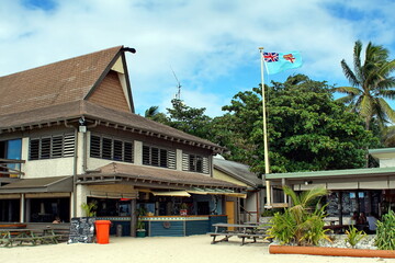 Fijian flag flying in front of a resort on Kuata Island, Fiji