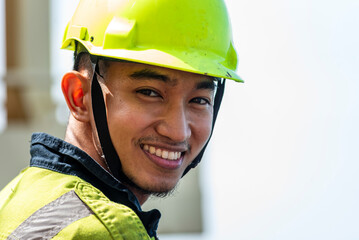 Portrait of the young Filipino officer, fully focused on his task during the inspection of the...