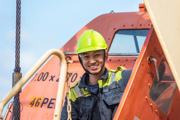 Portrait of the young Filipino officer, fully focused on his task during the inspection of the...