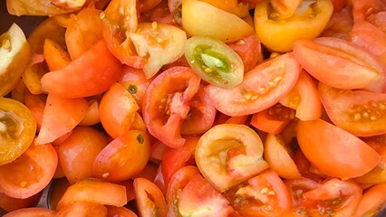 Sliced ​​tomatoes for background. Prepare tomatoes for cooking.