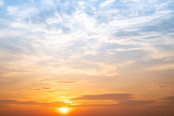 Obraz premium Beautiful , luxury soft gradient orange gold clouds and sunlight on the blue sky perfect for the background, take in evening,Twilight, Large size, high definition landscape photo
