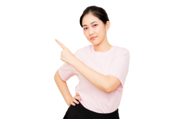Asian young woman in a pink shirt points to the side with a confident expression, conveying a sense of direction or suggestion.