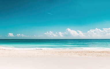 Fototapeta premium Idyllic Tropical Beach with Turquoise Water and White Sand Under a Blue Sky
