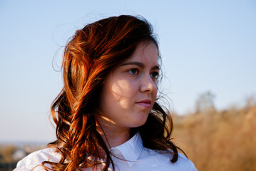 Portrait of a thoughtful woman outdoors in natural light