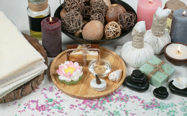 Spa massage items are arranged in a composition on the table.