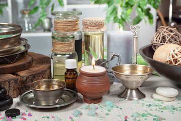 Spa massage items are arranged in a composition on the table.