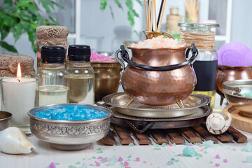 Spa items are arranged in a composition on a table.
