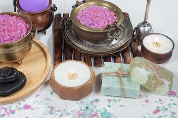 Spa items are arranged in a composition on a table.
