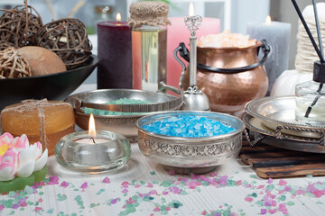 Spa items are arranged in a composition on a table.