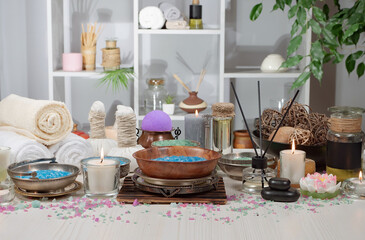 Spa massage items are arranged in a composition on the table.