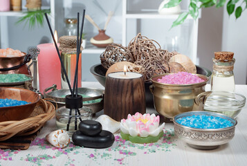 Spa massage items are arranged in a composition on the table.
