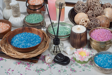 Spa items are arranged in a composition on a table.