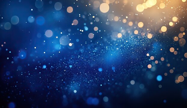 Abstract blue and gold bokeh background with sparkling dust particles