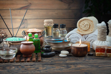 Spa massage items are arranged in a composition on the table.