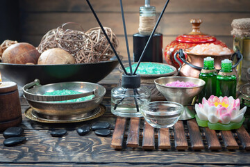 Spa items are arranged in a composition on a table.