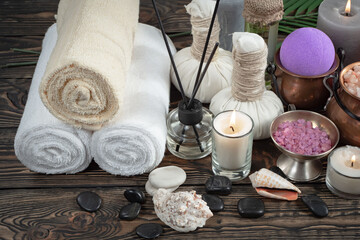 Spa items are arranged in a composition on a table.