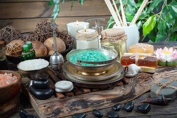 Spa massage items are arranged in a composition on the table.