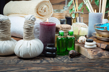 Spa massage items are arranged in a composition on the table.