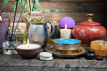 Spa massage items are arranged in a composition on the table.