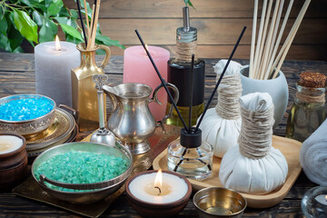 Spa massage items are arranged in a composition on the table.