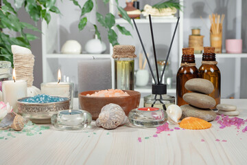 Spa massage items are arranged in a composition on the table.