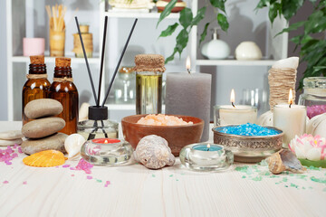 Spa massage items are arranged in a composition on the table.