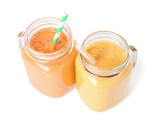 Mason jars of different tasty smoothie with straws on white background