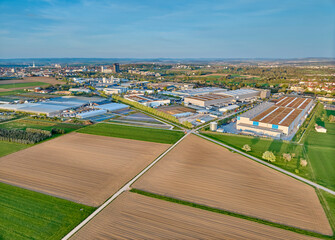 aerial photo of a industrial district between fertile farmland in Kornwestheim, Baden Wuerttemberg,...