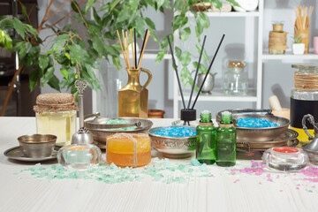Spa items are arranged in a composition on a table.