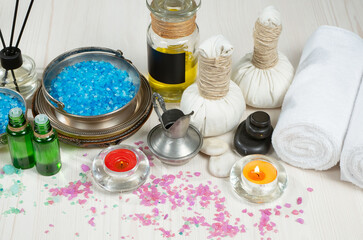 Spa massage items are arranged in a composition on the table.
