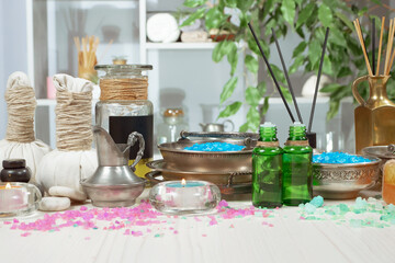 Spa massage items are arranged in a composition on the table.