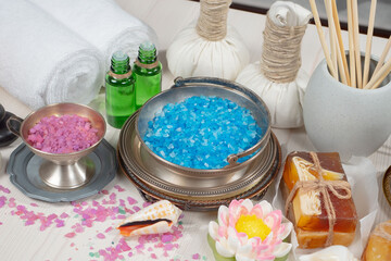Spa items are arranged in a composition on a table.