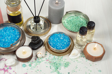Spa items are arranged in a composition on a table.