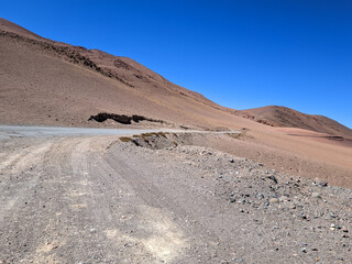 Mountain landscape at sunrise in the Argentine Puna near the Andes. With abandoned path to the field.