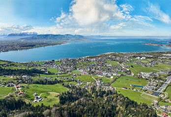 Fototapeta premium aerial view of the city of Lochau at Lake Constance with the highway entrance to Pfaender Tunnel in Vorarlberg, Austria