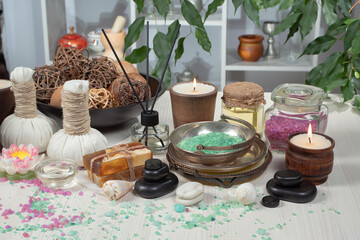 Spa massage items are arranged in a composition on the table.