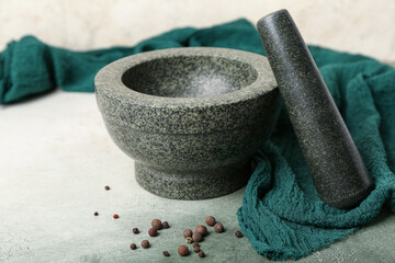 Mortar and pestle on light background