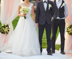 Bride and Groom Holding Hands at Wedding
