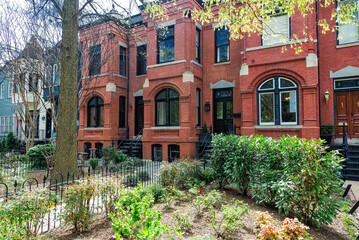 Naklejka premium Colonial Brick Row House, Townhouse with Entrance Porch and Garden on Quiet Street in Washington, D.C., USA
