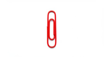 Obraz premium A red paperclip isolated object on white background