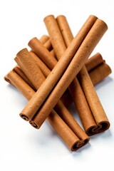 Close-up of aromatic cinnamon sticks on white background, top view, flavor, ingredient